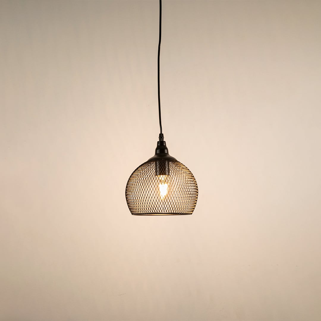 Black metal mesh pendant light glowing warmly on white background showcasing minimalist design.