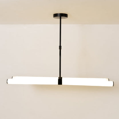 Warm-lit chandelier against a clean white background showcasing its modern linear design and suspended structure.