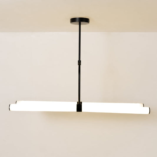 Warm-lit chandelier against a clean white background showcasing its modern linear design and suspended structure.