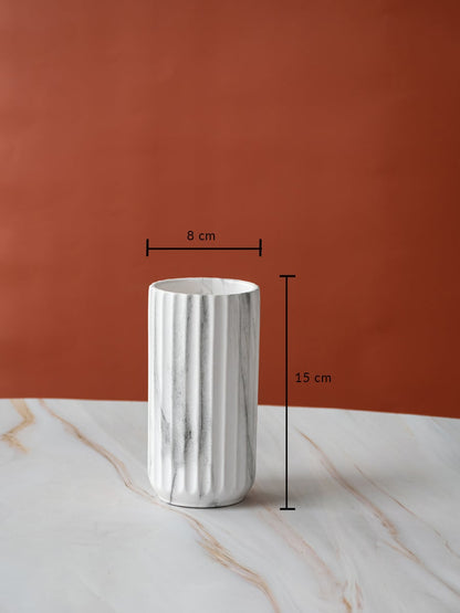 A marble textured cylindrical vase displayed with measurements showing 15 cm height and 8 cm width clearly outlining its compact size.