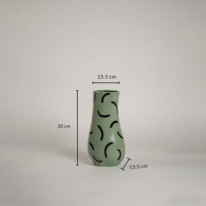 Green ceramic vase with black abstract pattern measuring 30 cm height 15 cm top width and 13 cm base width shown with exact dimensions.
