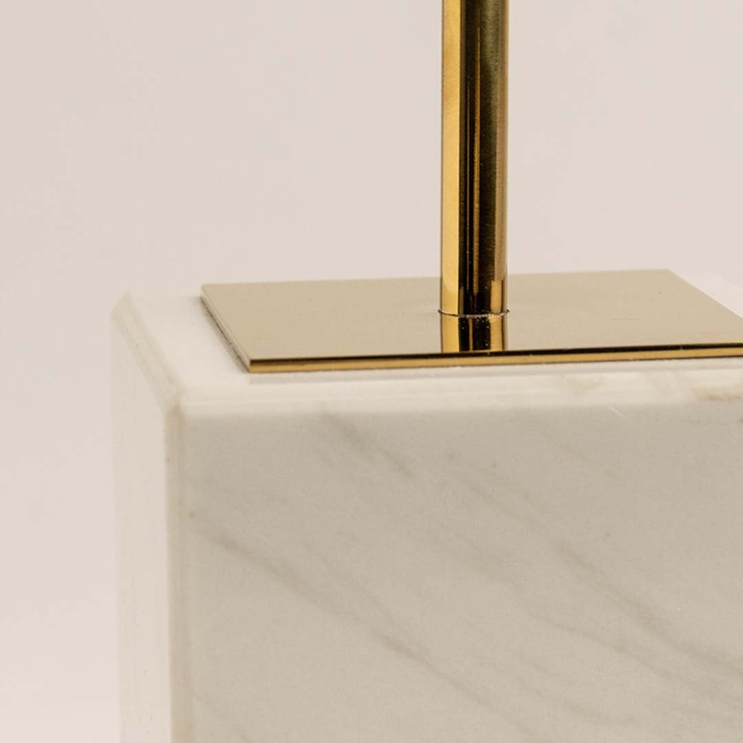 Closeup of marble base and gold stand of coral inspired sculpture showing premium polished modern finish.