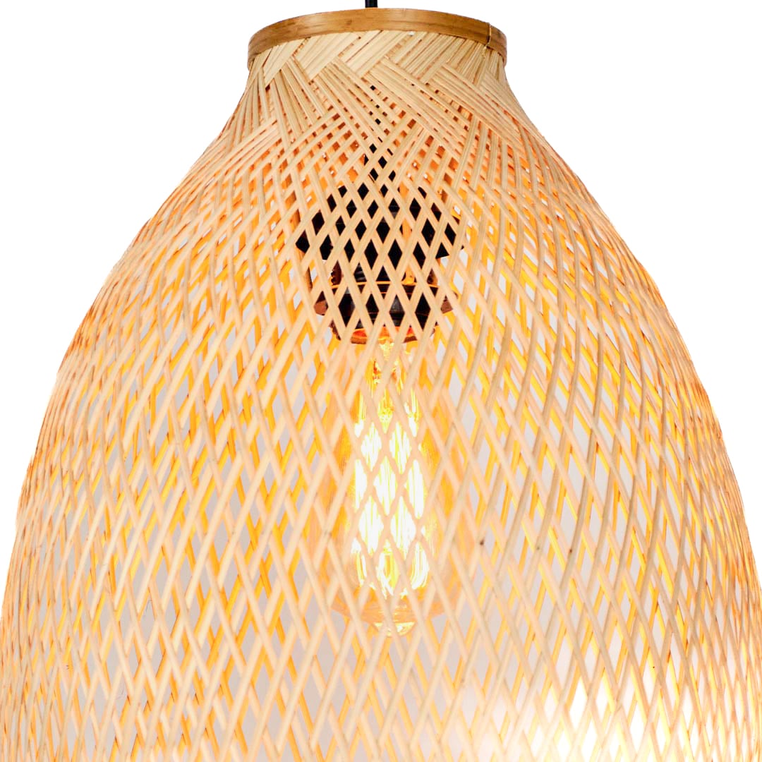 Closeup of woven rattan pendant light with natural beige texture showcasing handcrafted artisan details.