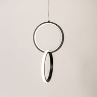 Black metal LED pendant light with glowing circular rings for stylish modern home decor lighting.