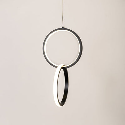 Black metal LED pendant light with glowing circular rings for stylish modern home decor lighting.