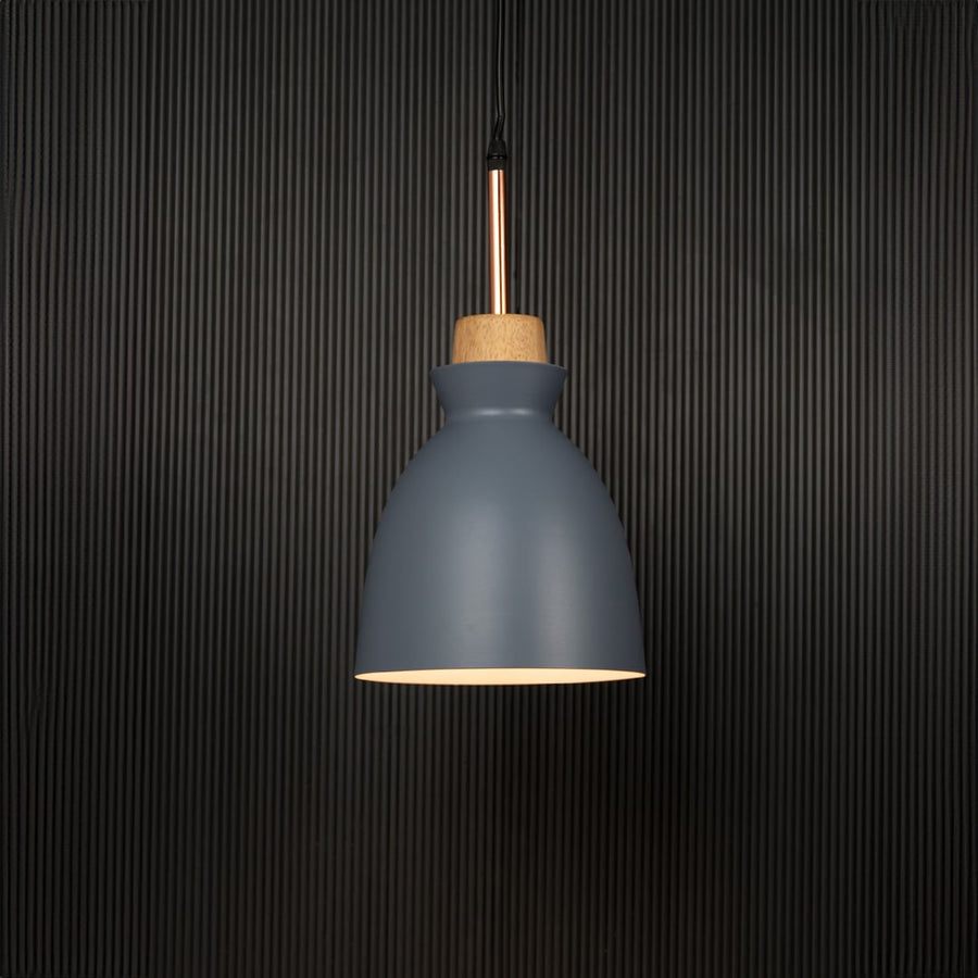 Grey pendant ceiling light with wooden accent illuminated on back background for elegant dining room and cafe ceiling lighting.