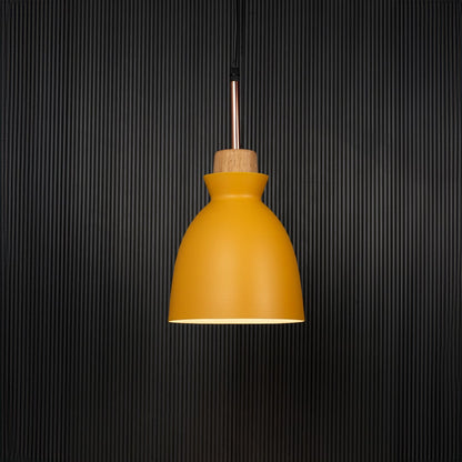 Yellow pendant ceiling light with wooden accent illuminated on back background for dining room cafe and modern interior decor lighting.