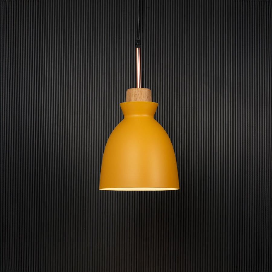 Yellow pendant ceiling light with wooden accent illuminated on back background for dining room cafe and modern interior decor lighting.