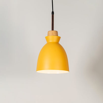 Yellow pendant ceiling light with wood top illuminated on white background for stylish dining room and kitchen decor lighting.