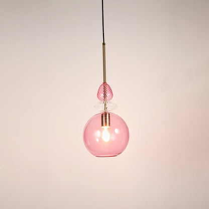 Contemporary pink glass globe pendant light metal hardware white background hanging light.