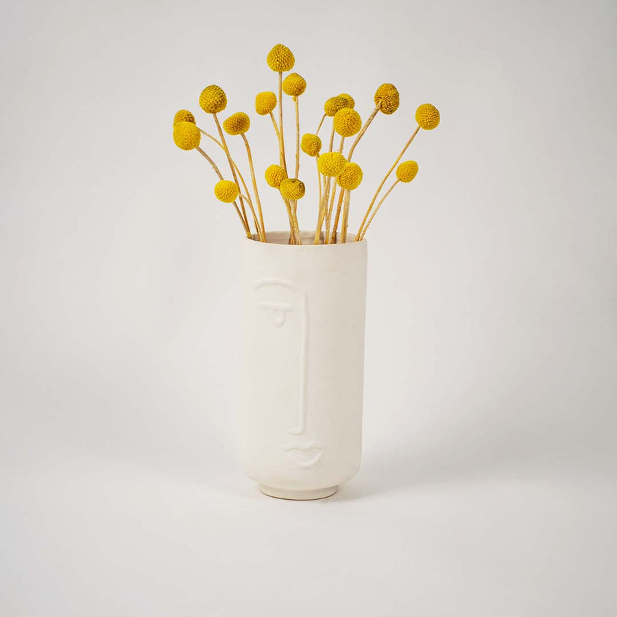 Tall white ceramic face vase shown on a clean white background highlighting its smooth finish and modern artistic design for tabletop decor.