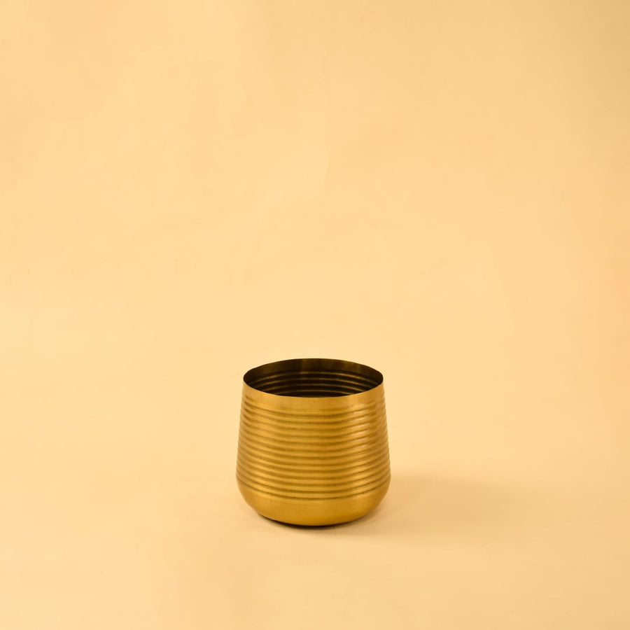 Gold metal planter decor on clean white background ideal for bright modern shelves consoles and tabletop styling.