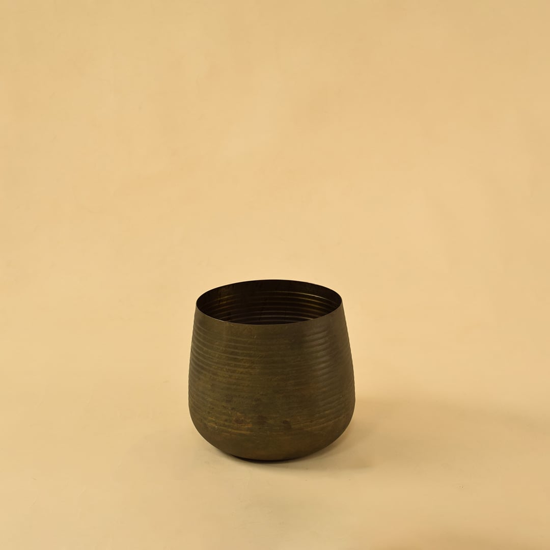 Brown metal planter decor on clean white background ideal for modern shelves consoles and tabletop styling.