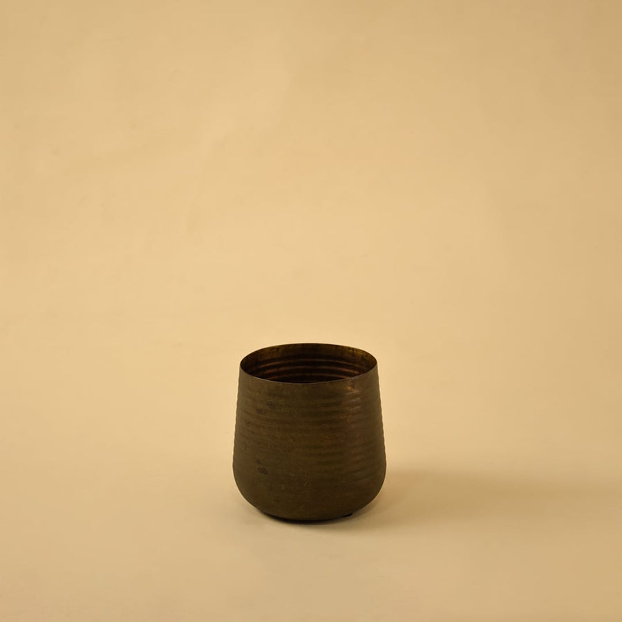 Brown metal planter decor on clean white background ideal for contemporary shelves consoles and tabletop styling.