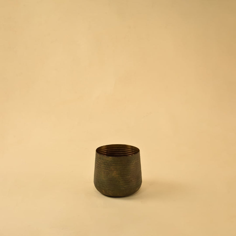 Brown metal planter decor on clean white background ideal for modern home shelves consoles and tabletop styling.