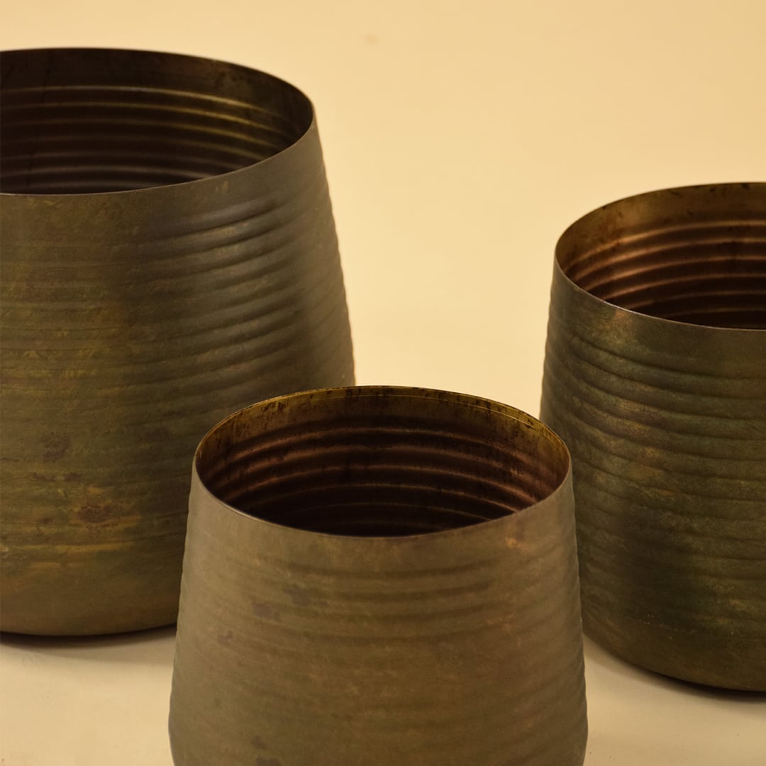 Brown metal planter closeup showing textured finish and earthy tone ideal for modern living room and tabletop styling.
