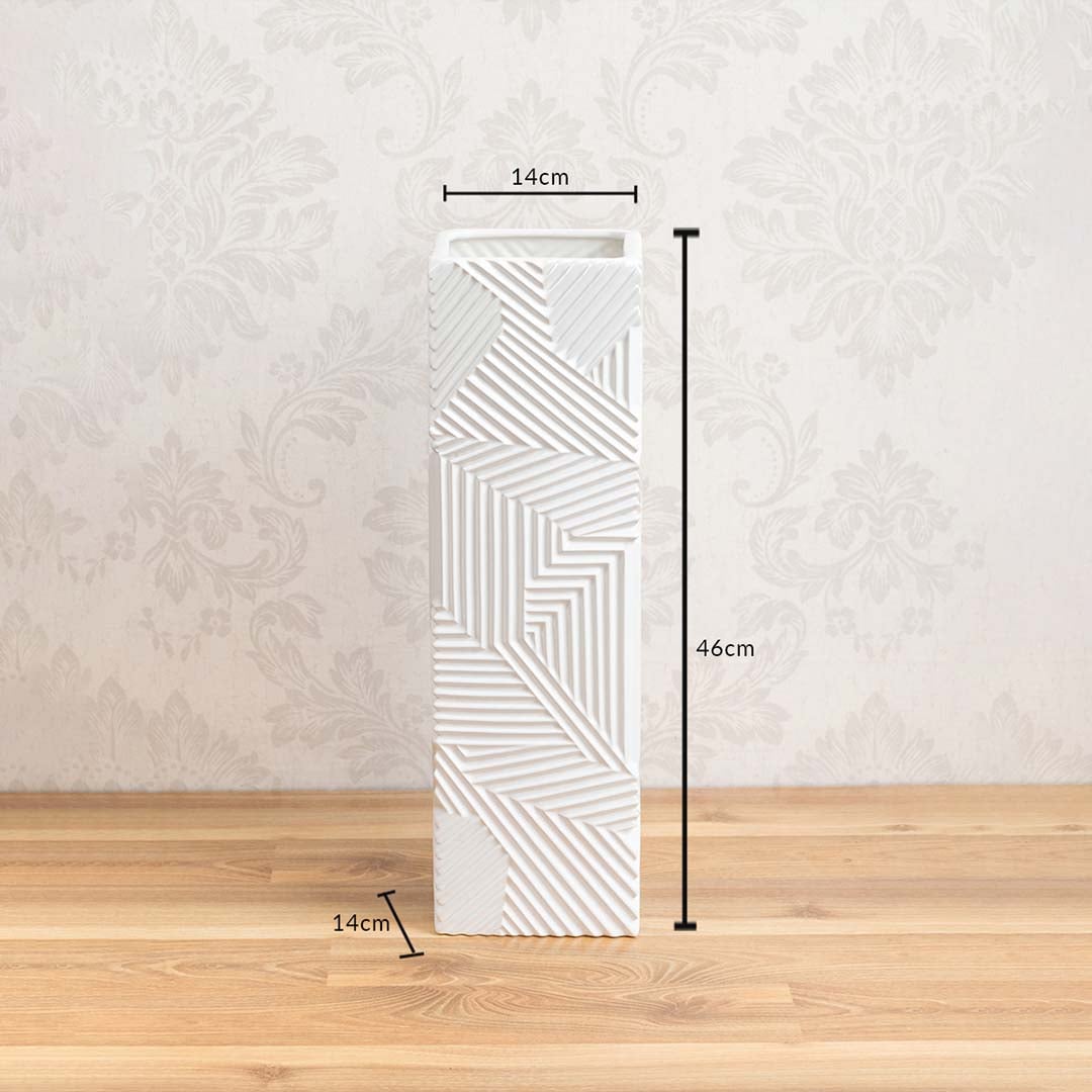 Tall white geometric ceramic vase with 46 cm height and 14 cm width shown on a light background with decorative pattern detailing.
