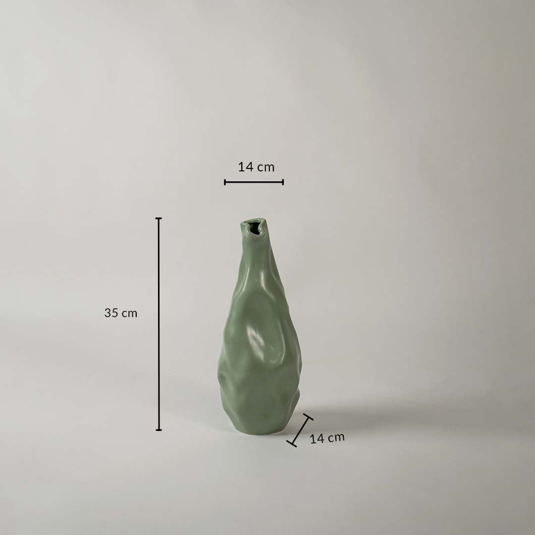 Green sculpted vase shown with dimensions 35 cm height 14 cm width and 14 cm base depth giving a clear view of its flowing organic form and modern decorative design.