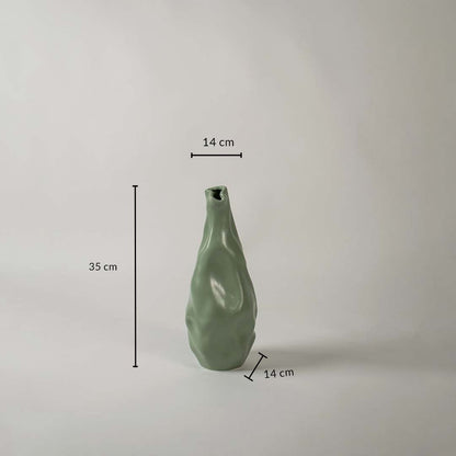 Green sculpted vase shown with dimensions 35 cm height 14 cm width and 14 cm base depth giving a clear view of its flowing organic form and modern decorative design.