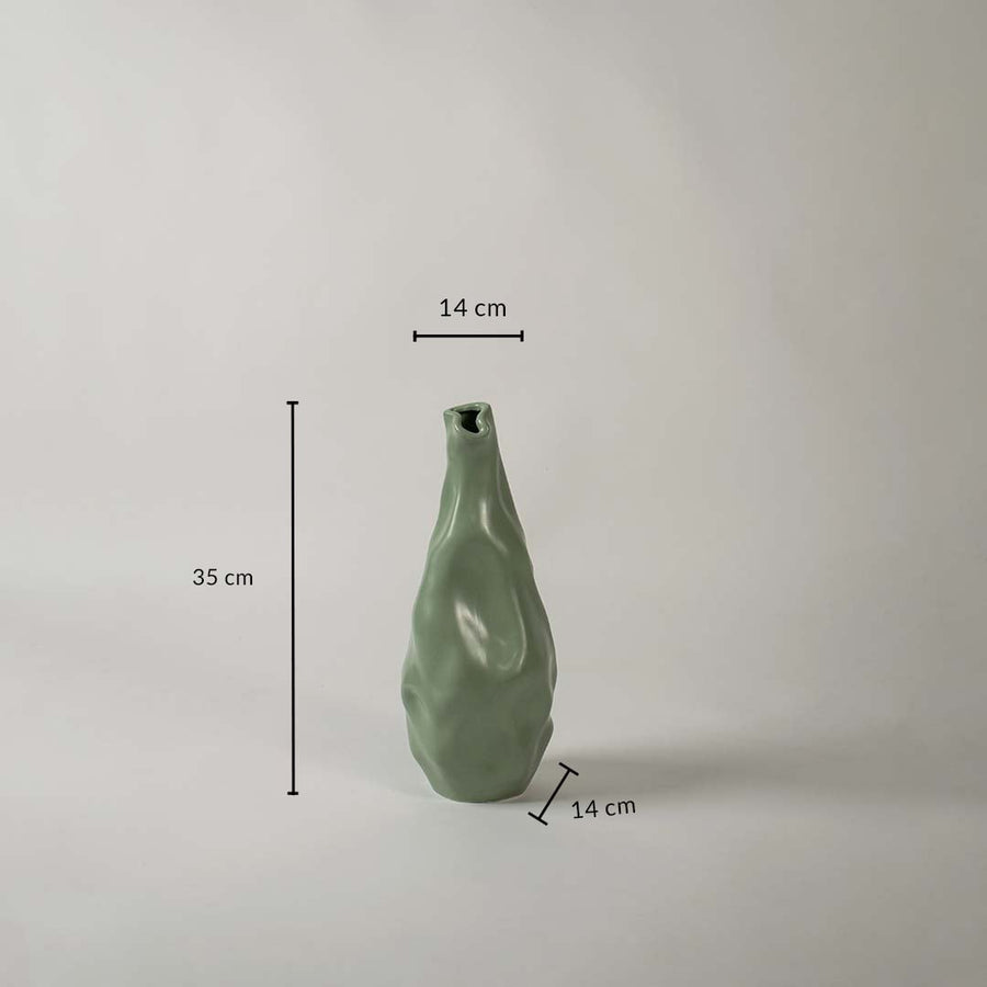 Green sculpted vase shown with dimensions 35 cm height 14 cm width and 14 cm base depth giving a clear view of its flowing organic form and modern decorative design.