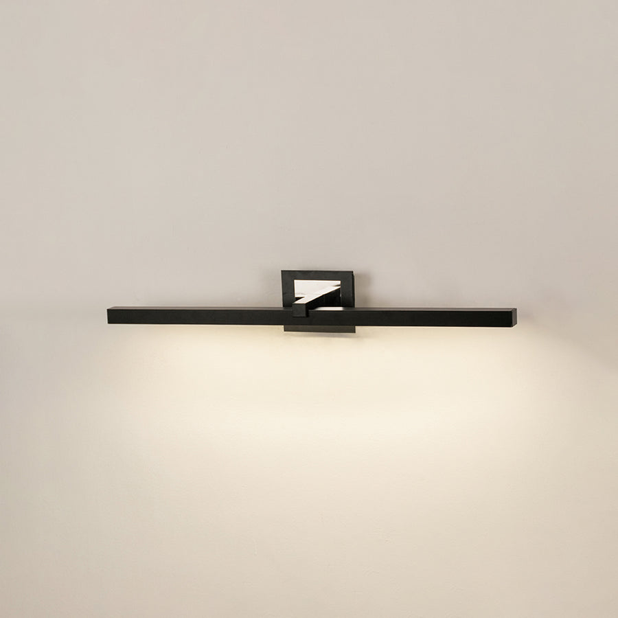 Modern wall light in black metal finish with linear bar design for bathroom or vanity decor lighting white background.