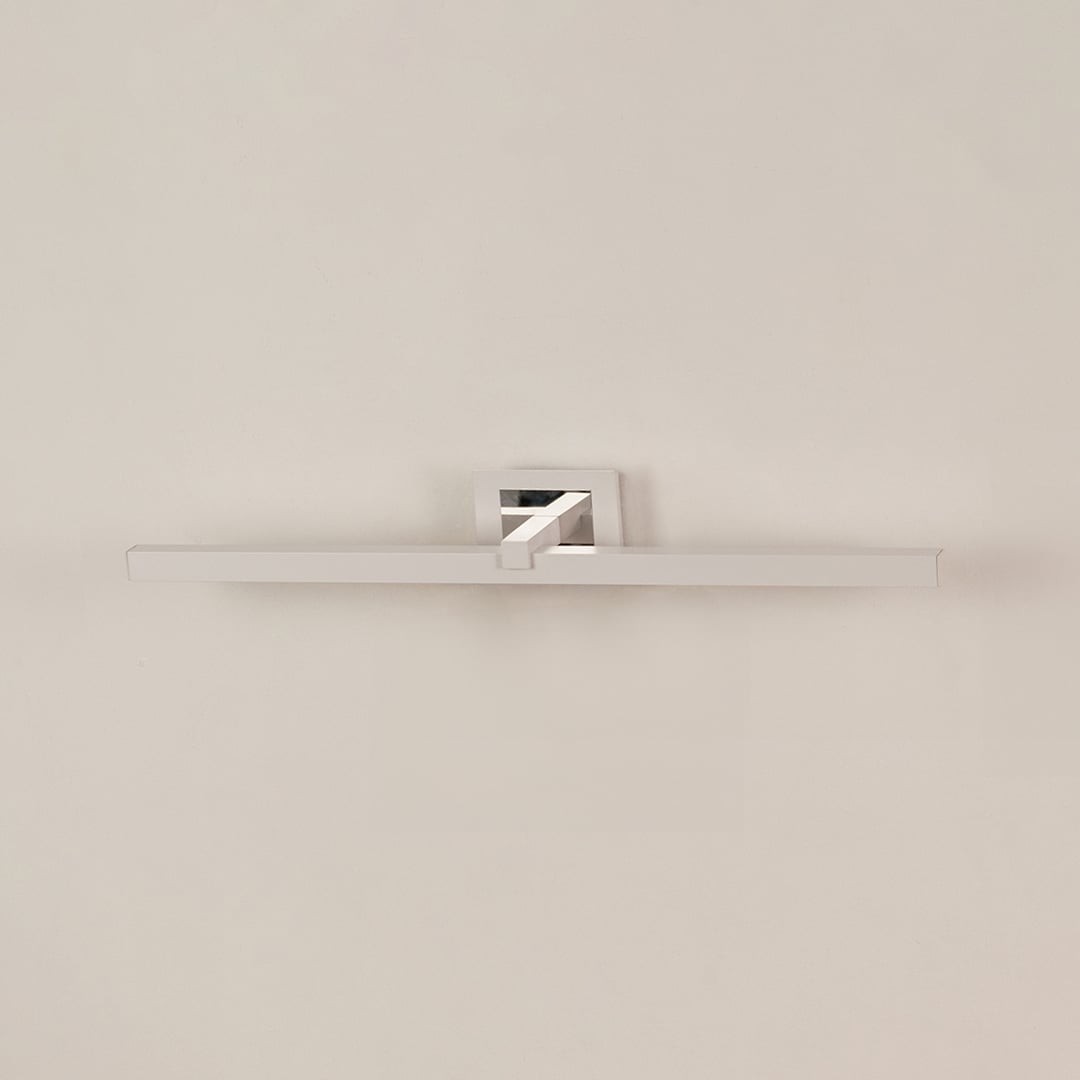 Silver metal picture light displayed on a white background with the light off highlighting its sleek design.