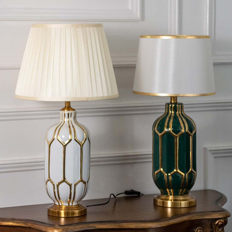Pair of white and green ceramic table lamps with gold metal detailing and soft shades turned off showcasing modern luxury and timeless design.