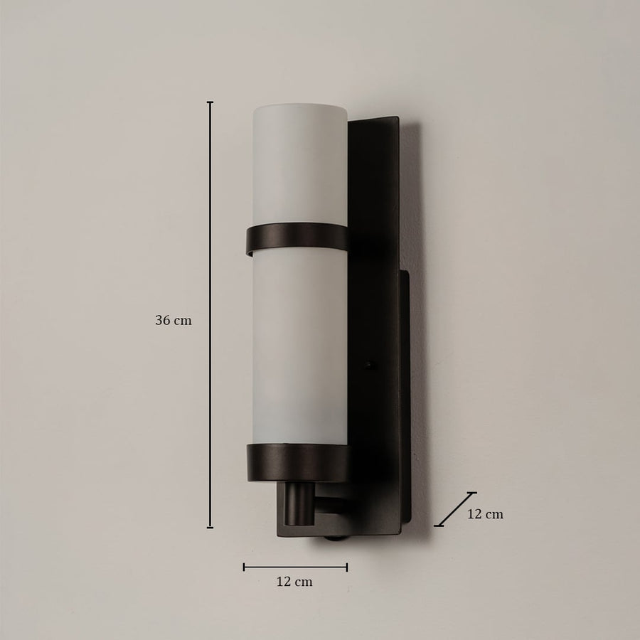 Black metal wall light with frosted glass shade shown with 36 cm height and 12 cm width measurements for indoor use.