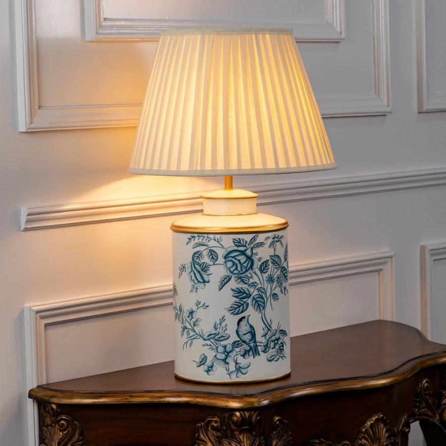 White ceramic floral table lamp with pleated fabric shade for luxury bedside table and living room lighting decor.