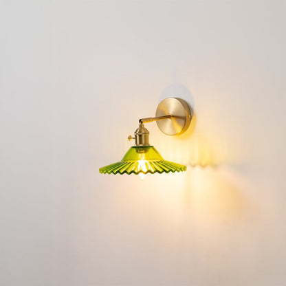 Gold metal wall light with green glass shade for elegant modern ambient lighting decor styling ideas.