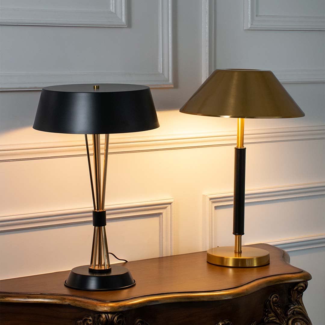 Black and gold table lamps with illuminated wide shades shown together highlighting stylish lighting options for modern desks and workspaces.