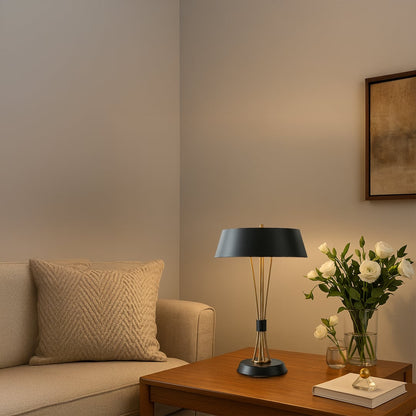 Black and gold table lamps with wide shades displayed together with lights off showcasing elegant modern design for home or office decor.