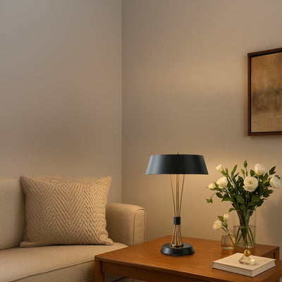Black and gold table lamps with wide shades displayed together with lights off showcasing elegant modern design for home or office decor.