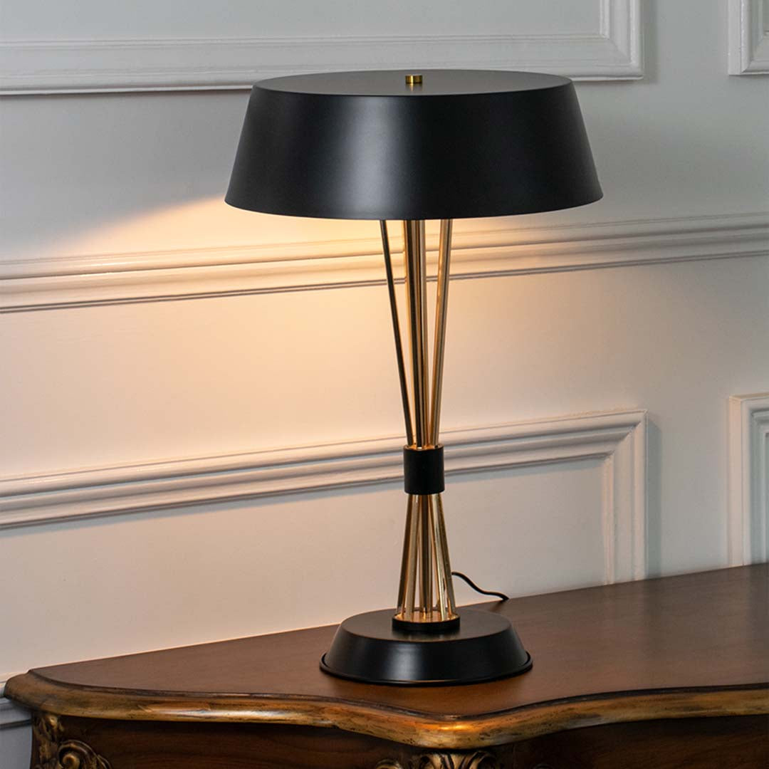 Black metal table lamp with black fabric shade and tapered base offering sophisticated contemporary decor lighting.