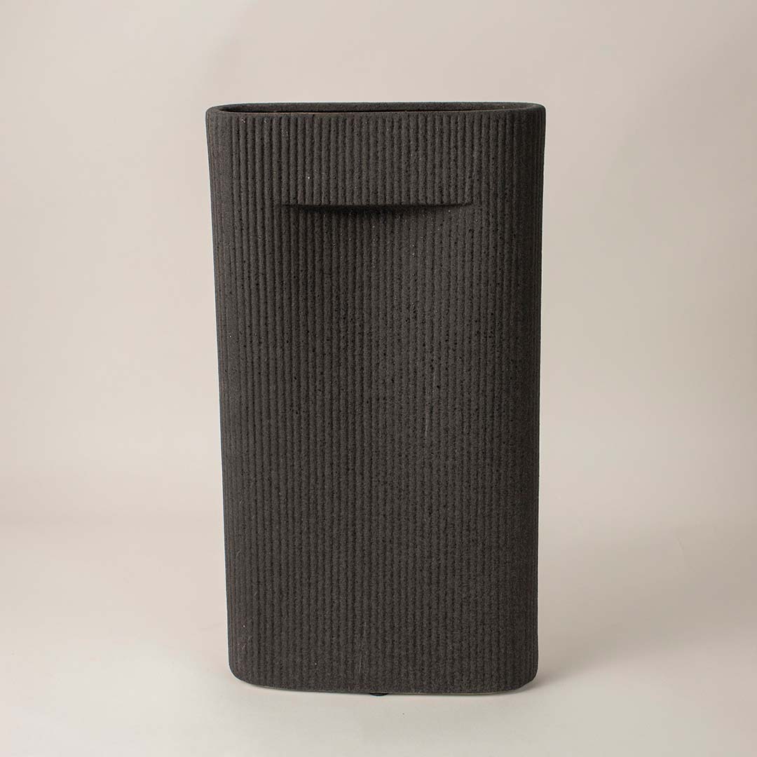 Matte black rectangular ribbed ceramic vase on white background showing minimalist handcrafted home decor design.