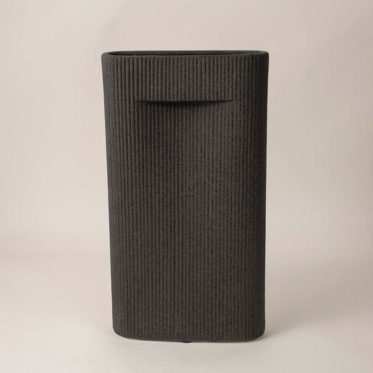 Matte black rectangular ribbed ceramic vase on white background showing minimalist handcrafted home decor design.