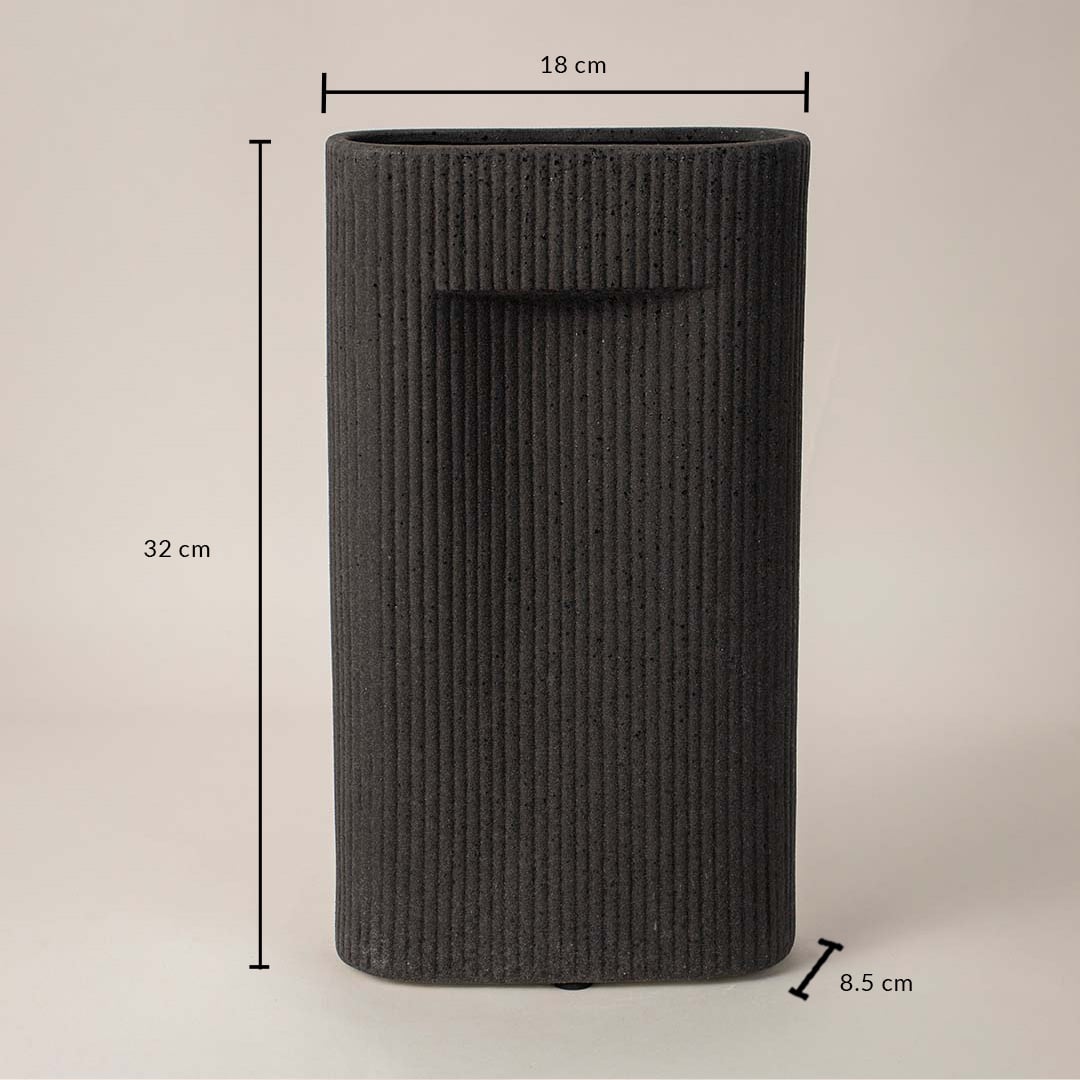 Tall black textured ceramic vase with dimension display placed on white surface against neutral background showcasing size and contemporary home decor design.