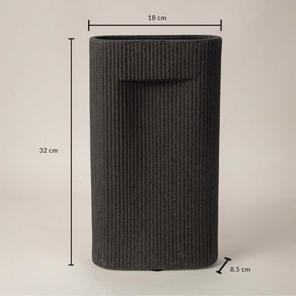 Tall black textured ceramic vase with dimension display placed on white surface against neutral background showcasing size and contemporary home decor design.