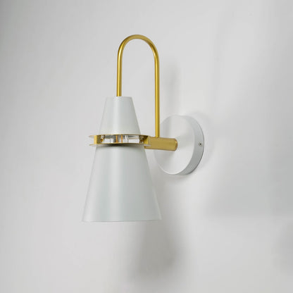 Modern wall light on white background with light off displaying matte white cone shade and brass accent.