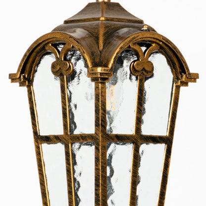 Closeup capturing ornate brass design and textured glass panels of classic hanging lantern ceiling light.