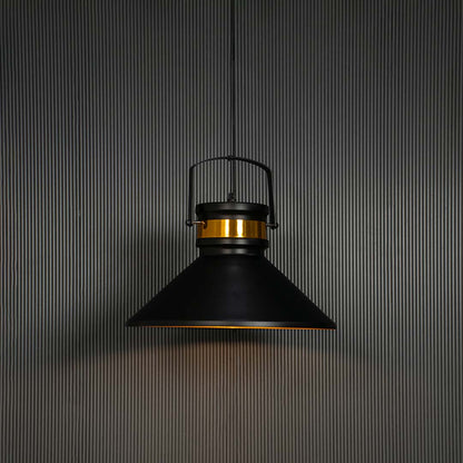 Matte black pendant light turned on with golden shade interior glowing against black background for luxury interiors.