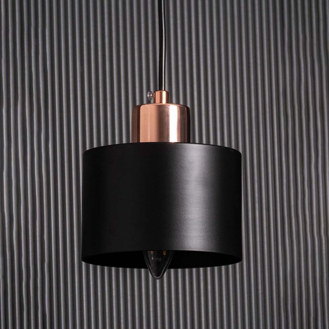 Detailed closeup of gold and amber glass wall light highlighting the glossy globe texture and elegant metal frame for contemporary interior styling.