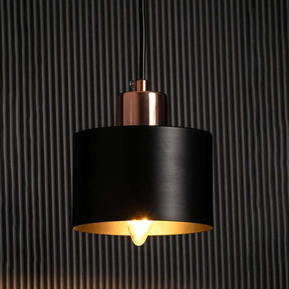 Amber glass globe wall light glowing warmly on a dark background showcasing its soft ambient lighting effect and elegant golden metal frame.