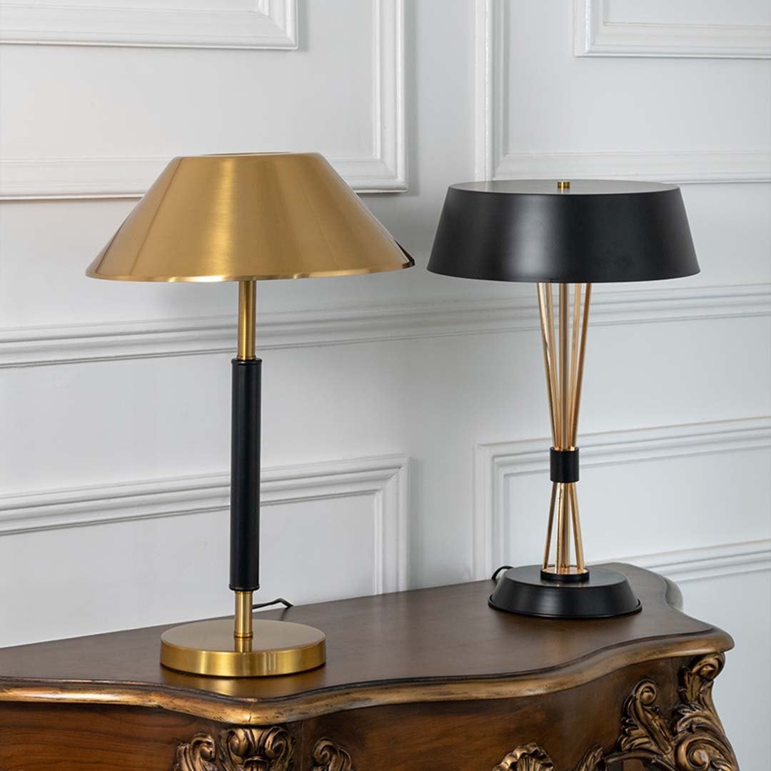 Gold and black metal table lamps with metallic shades for elegant modern lighting decor styling ideas.