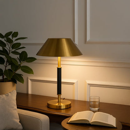Gold metal table lamp with black stem and metallic shade for elegant modern lighting decor styling.