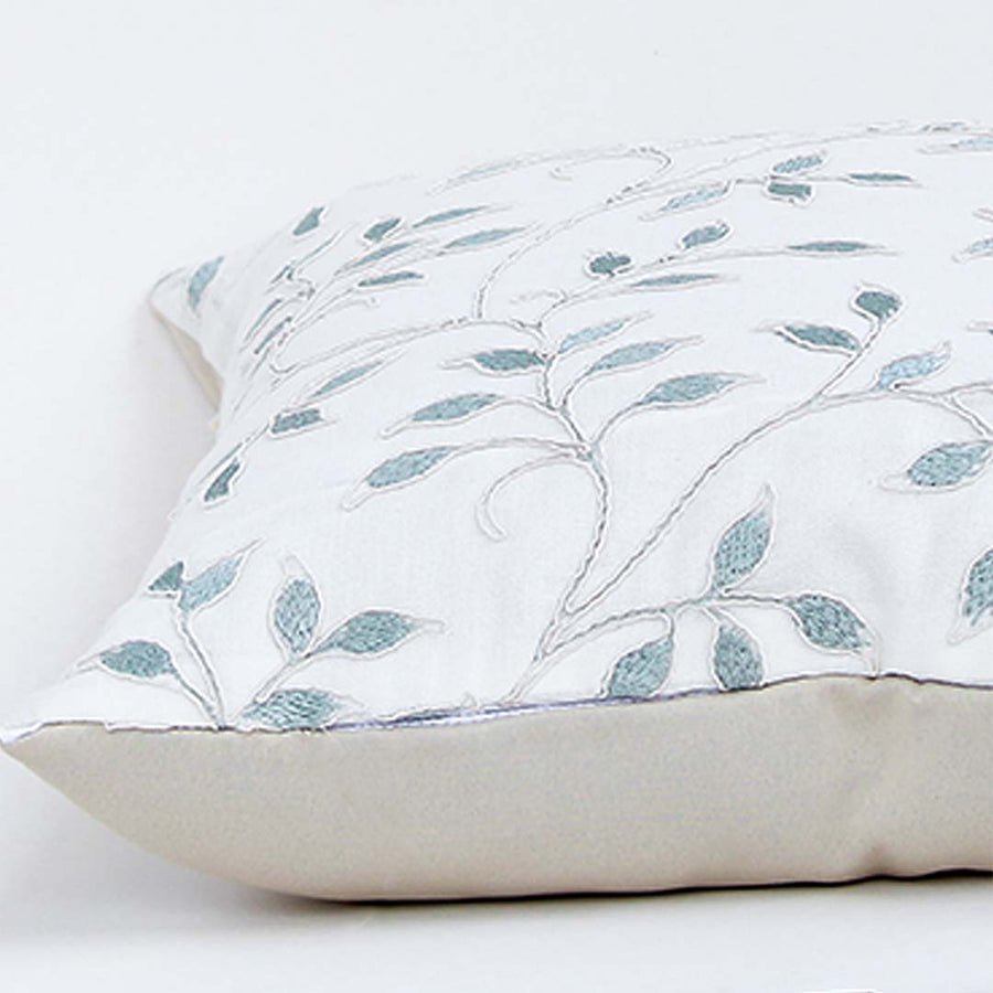 White cotton cushion cover with soft blue botanical leaf print for sofa bedroom and contemporary home decor styling.