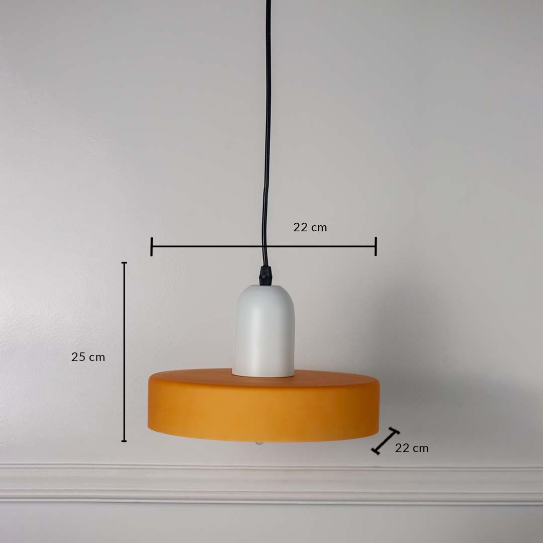 White and mustard yellow pendant ceiling light with height 25 cm and width 22 cm shown clearly on plain off white background.