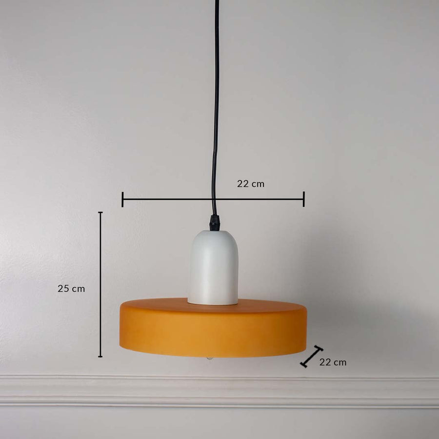 White and mustard yellow pendant ceiling light with height 25 cm and width 22 cm shown clearly on plain off white background.