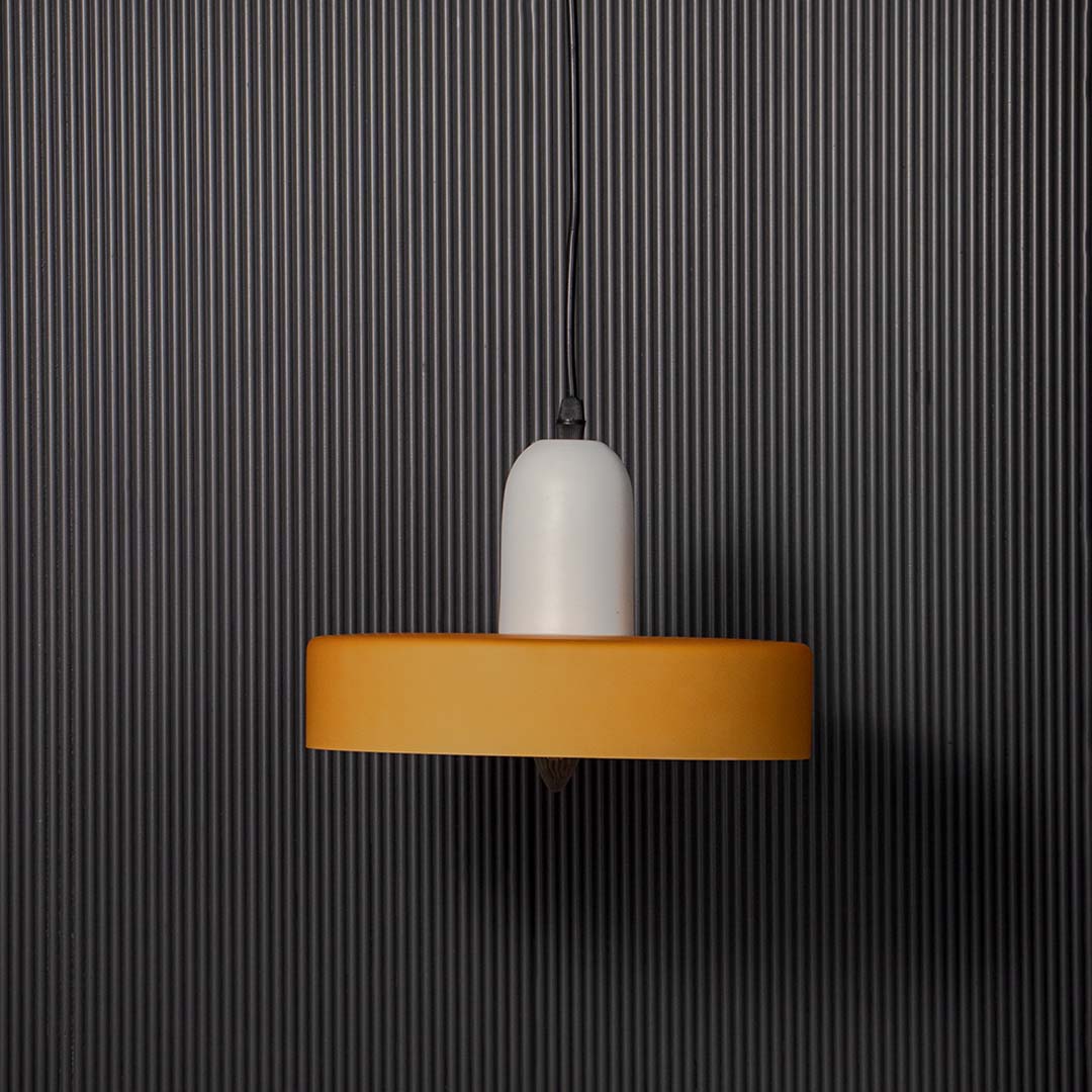Minimal wall light with white glass diffuser and gold accent shown unlit on black background for contemporary interior wall Decor.