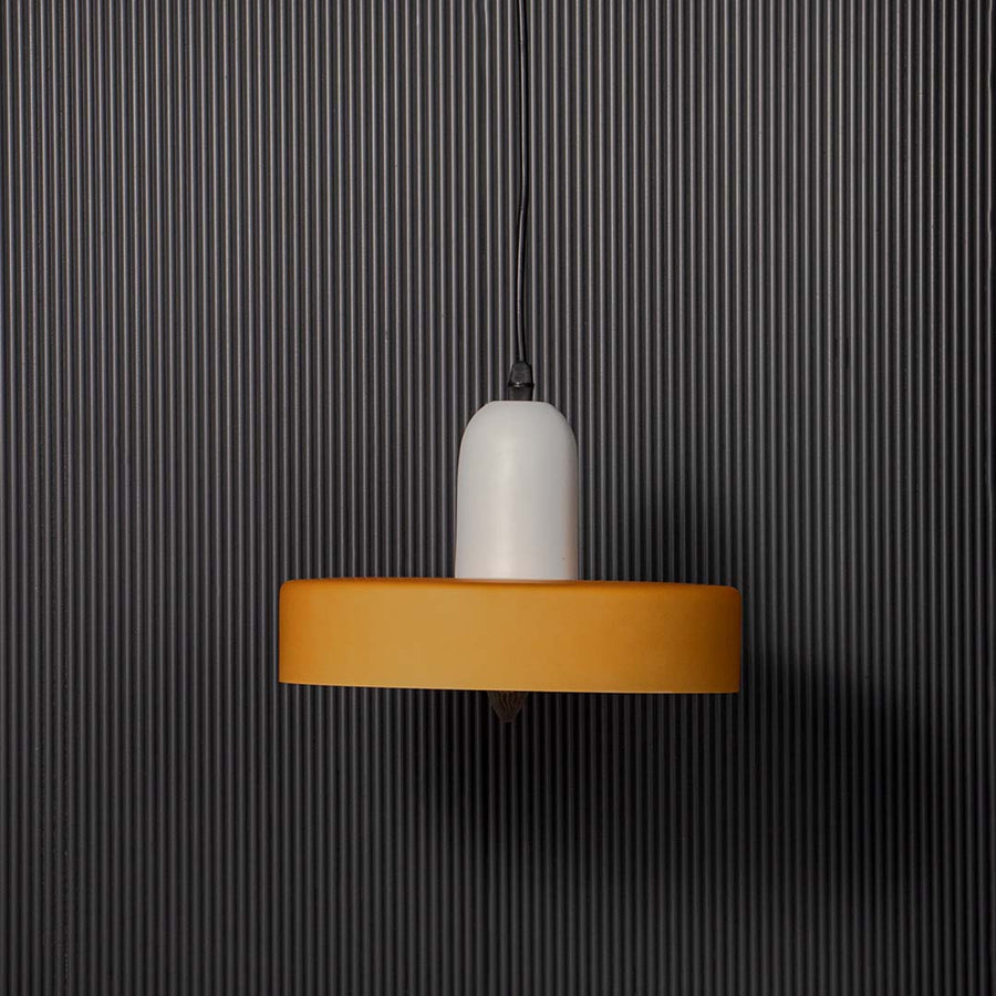 Minimal wall light with white glass diffuser and gold accent shown unlit on black background for contemporary interior wall Decor.